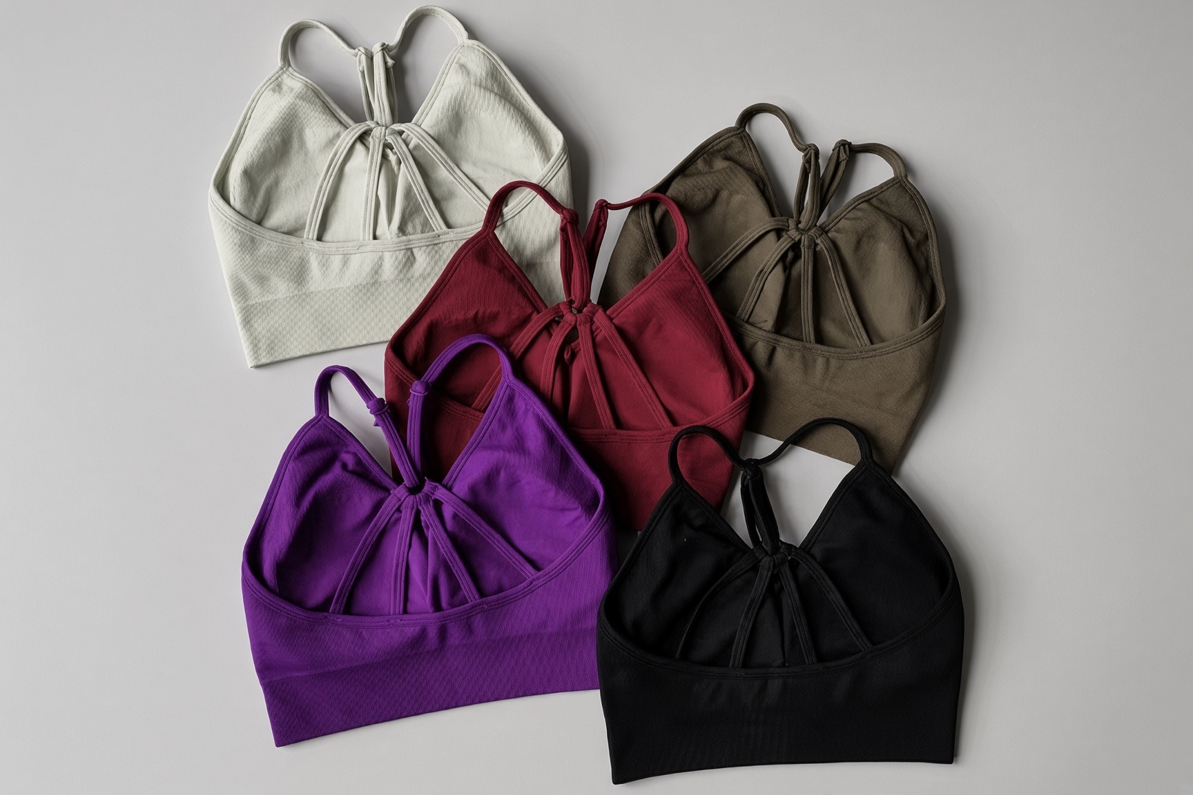 Impact Set bras, five colors | VELA VELA Impact Set sports bras in Sand, Bordeaux, Olive, Violet, and Onyx, strappy backs