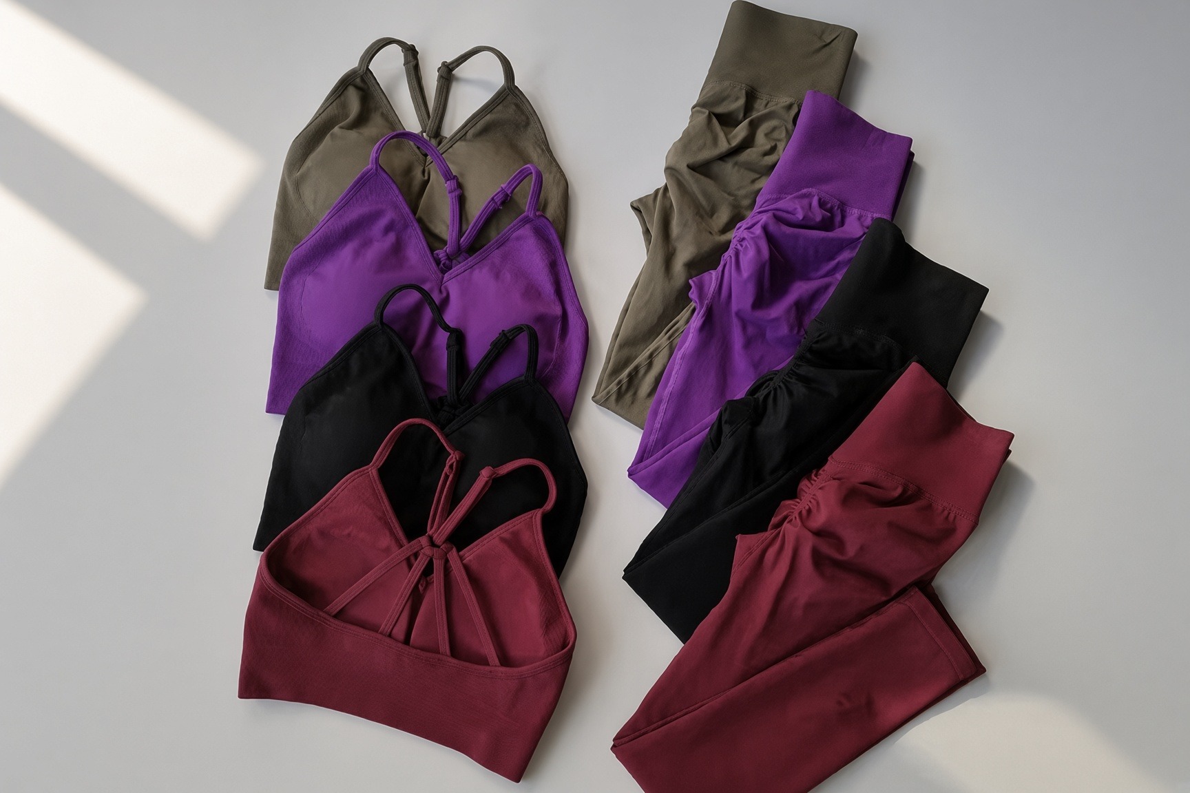 Impact Set color story | VELA VELA Impact Sets laid together in Olive, Violet, Onyx, and Bordeaux